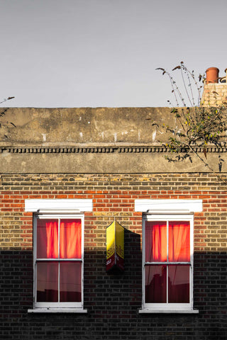 Orange curtains on Beck Road East London