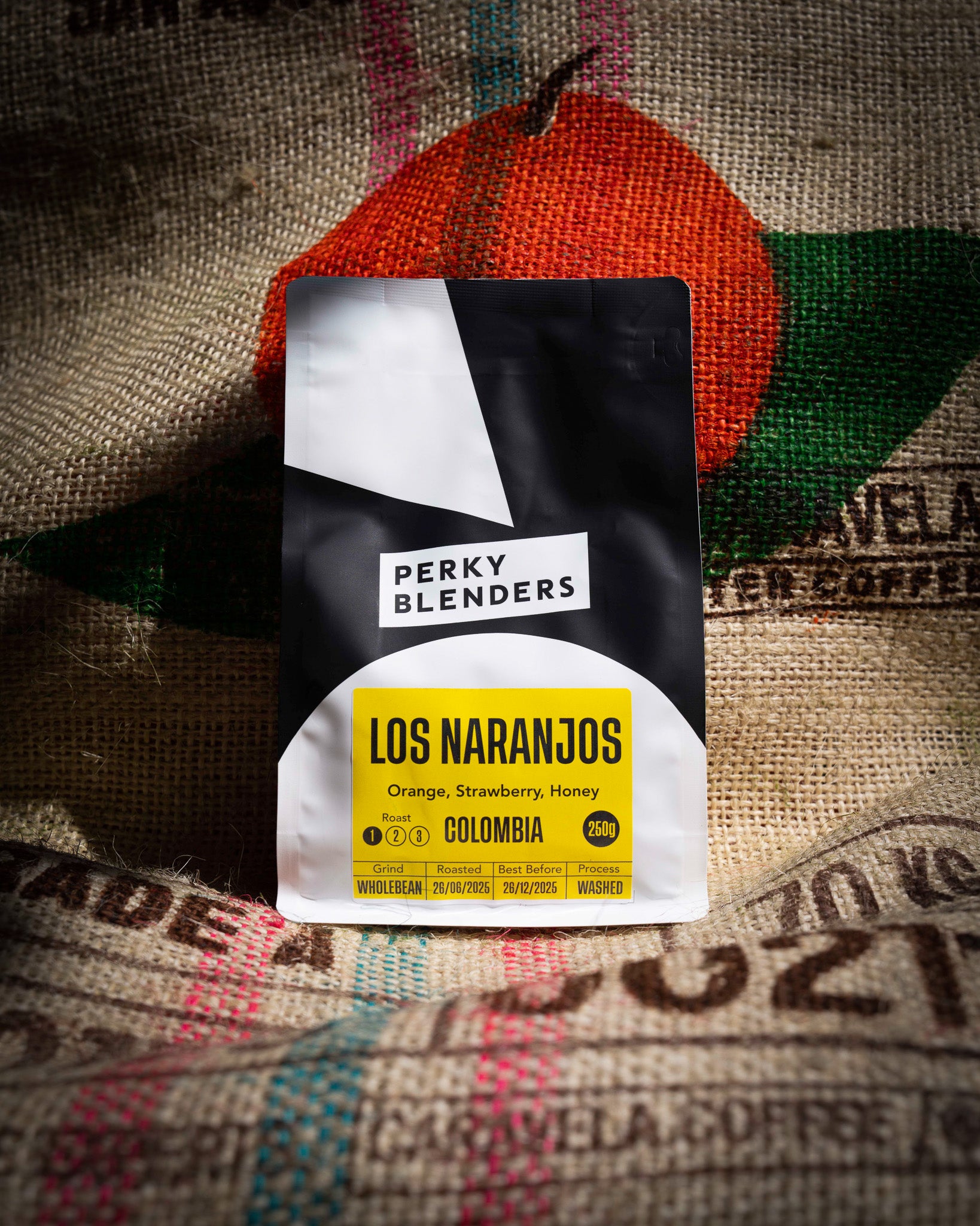 Perky Blenders coffee package on a textured fabric background
